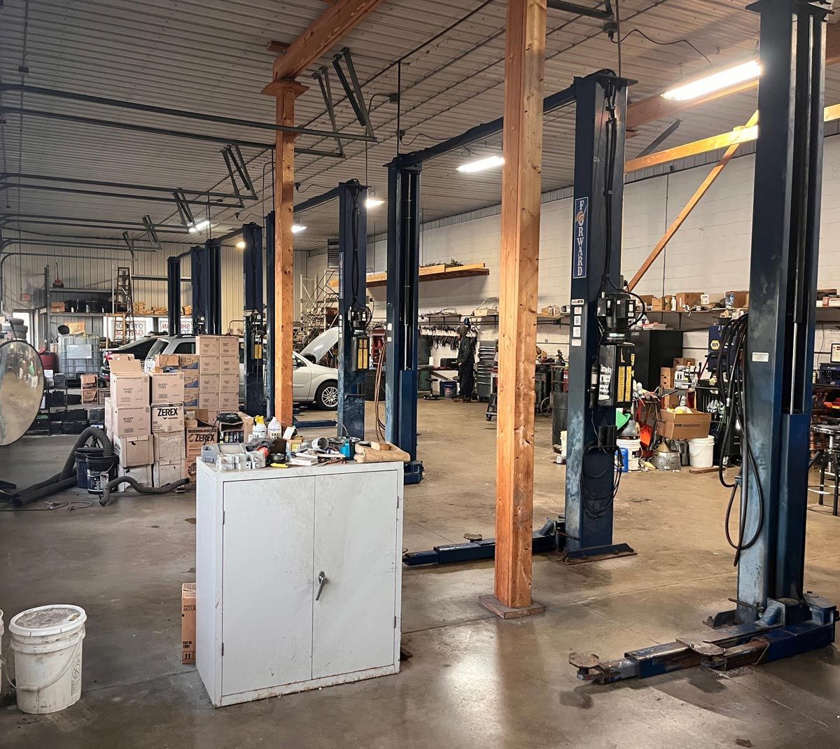 Inside Of Garage With Lifts And Cabinet — O'Fallon, MO — O'Fallon Garage
