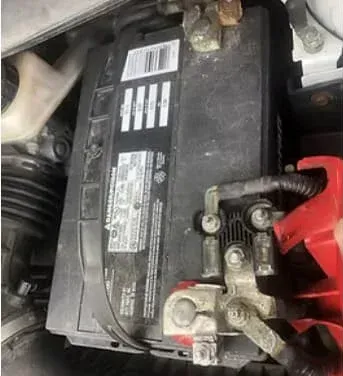 Car battery with corroded terminals.