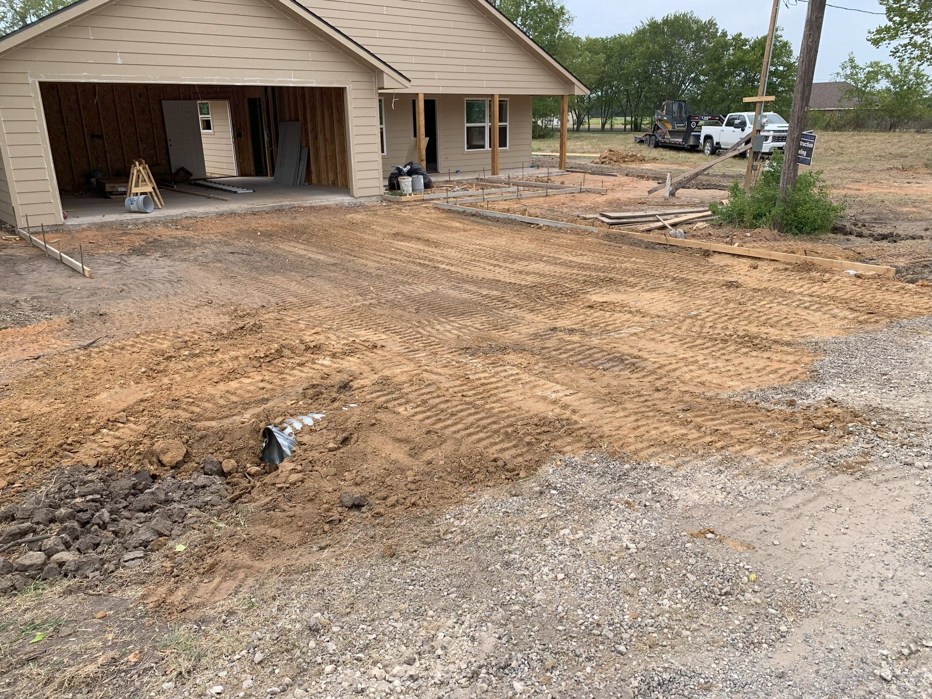 Off duty land management land clearing excavation, yard smoothed out.