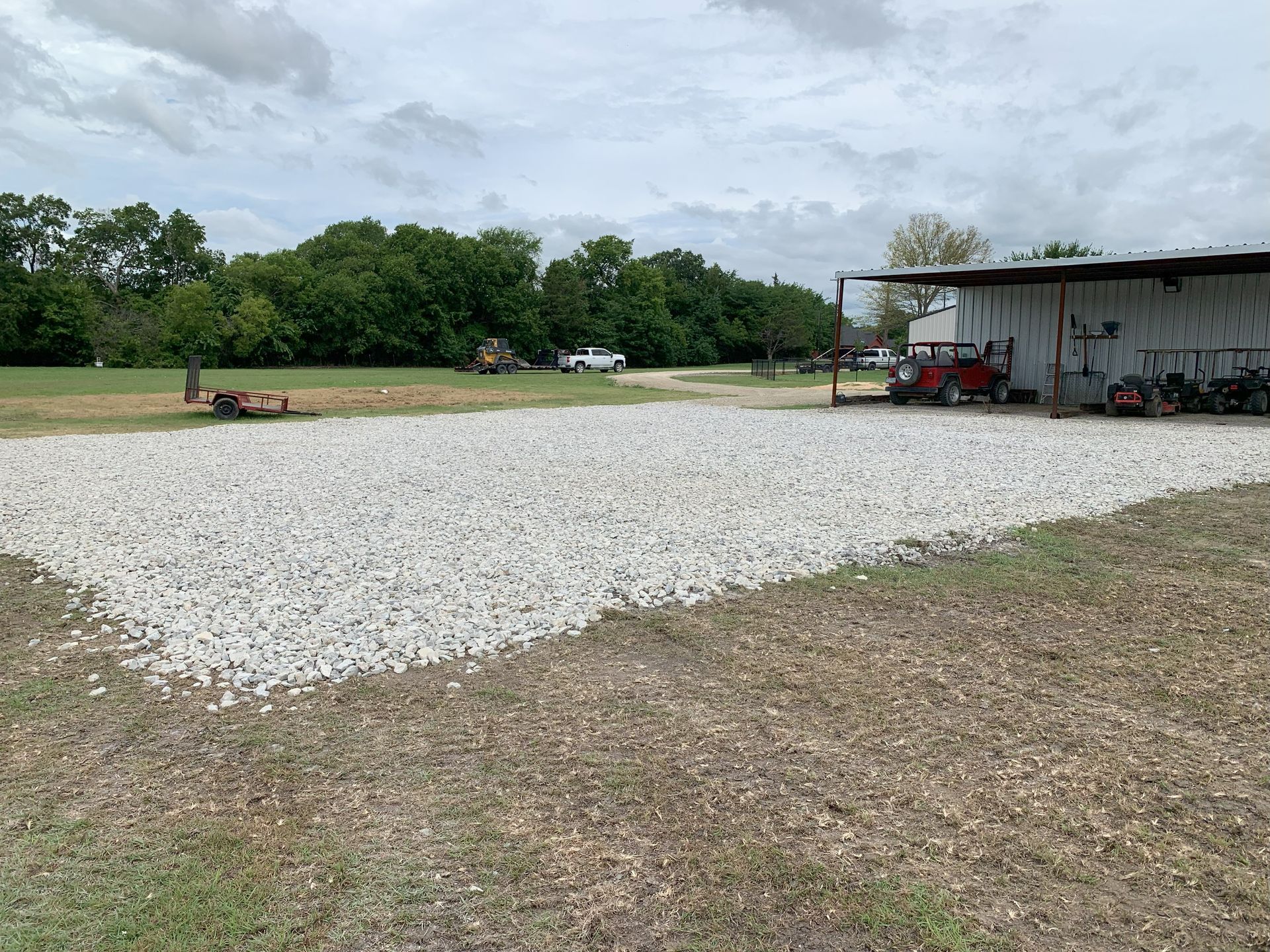 Land clearing, excavation, road work and rock parking area.