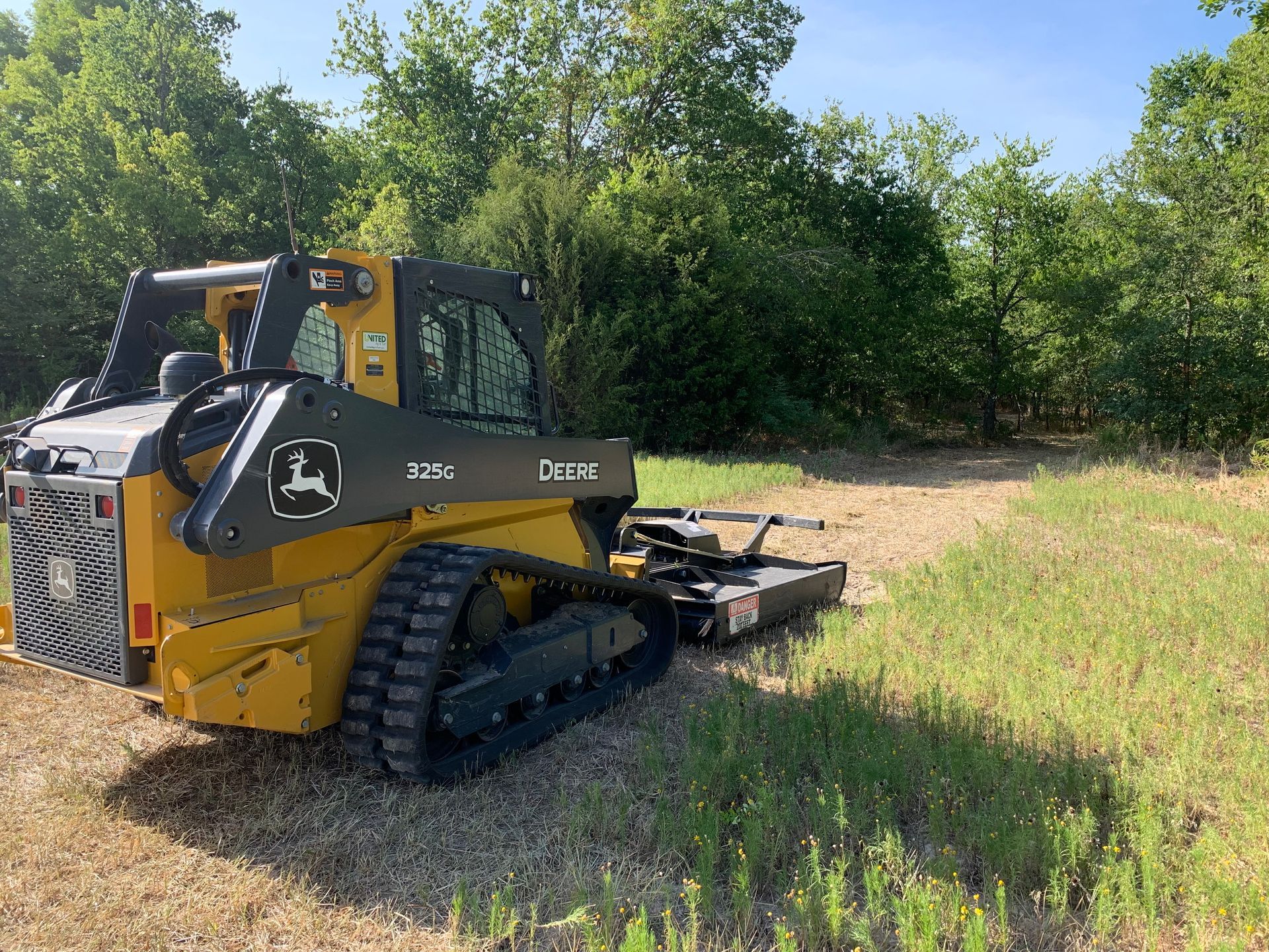 Road work skid steer, land clearing.