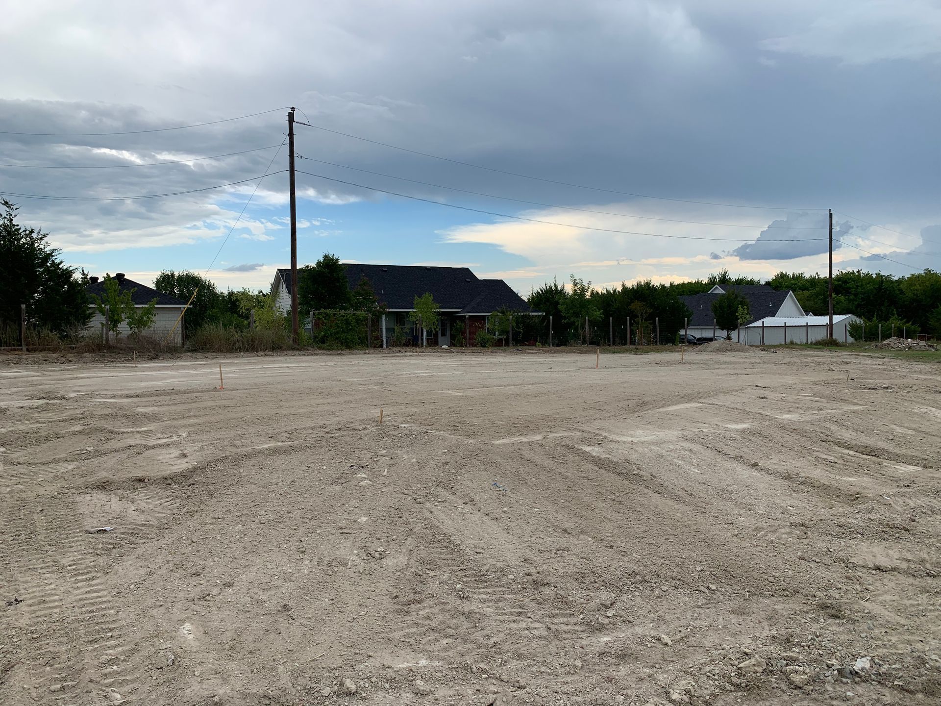 Skid steer, house pad, clean dirt smoothed out