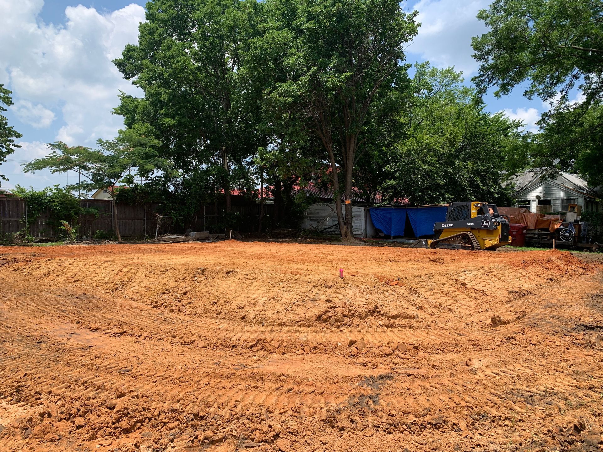 Building house pad, clean dirt