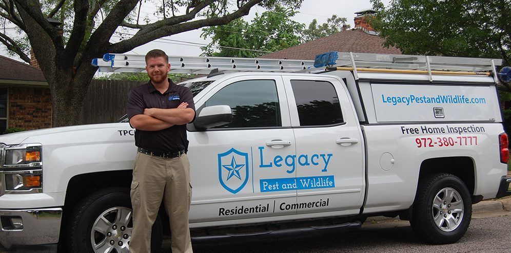 A man is standing in front of a legacy truck