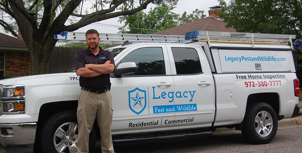 A man is standing in front of a legacy truck
