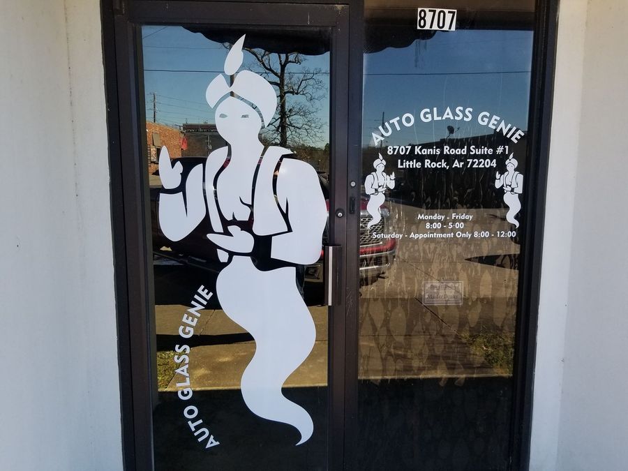 a door with a genie on it that says auto glass genie