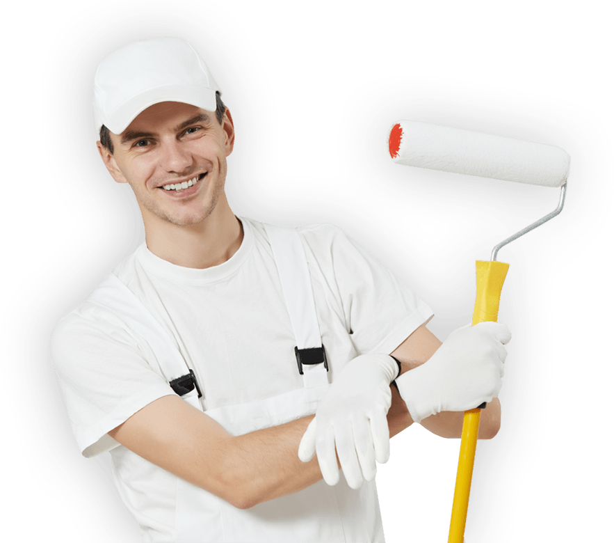 A man in white overalls is holding a paint roller