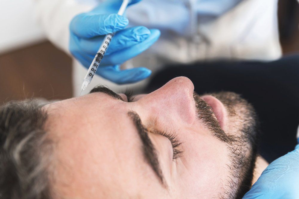 Injecting Botox On Man — Jacksonville, FL — Ageless Rejuvenation Center