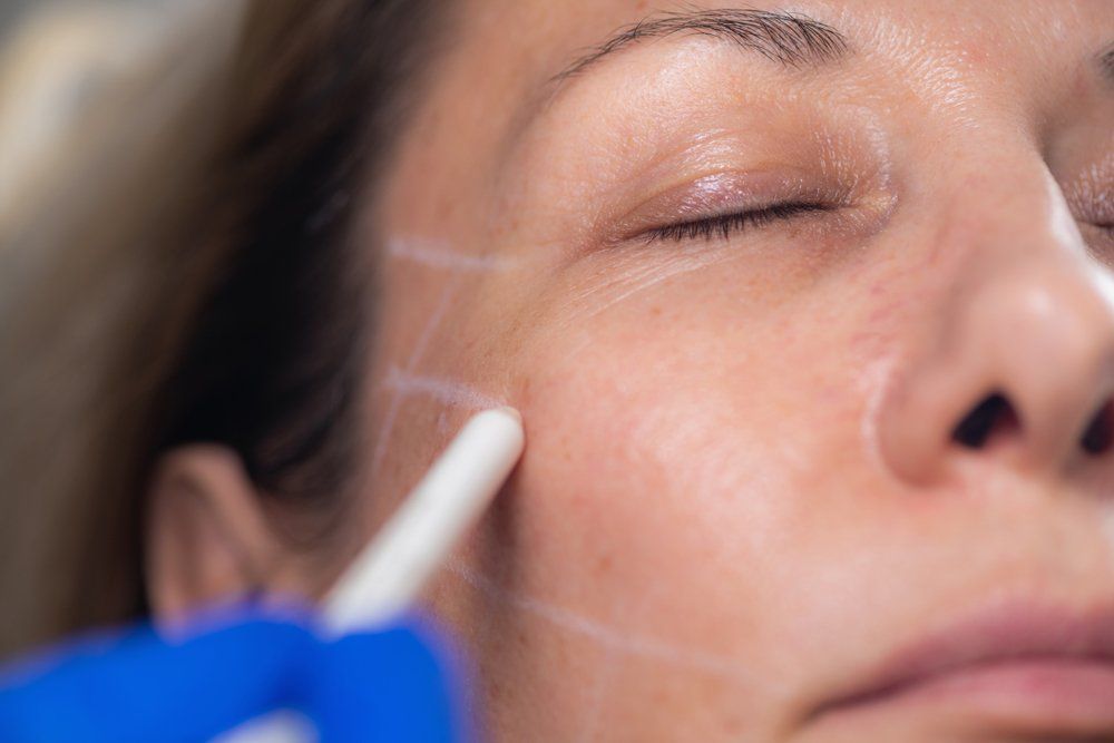 Woman Applying Skin Product — Jacksonville, FL — Ageless Rejuvenation Center