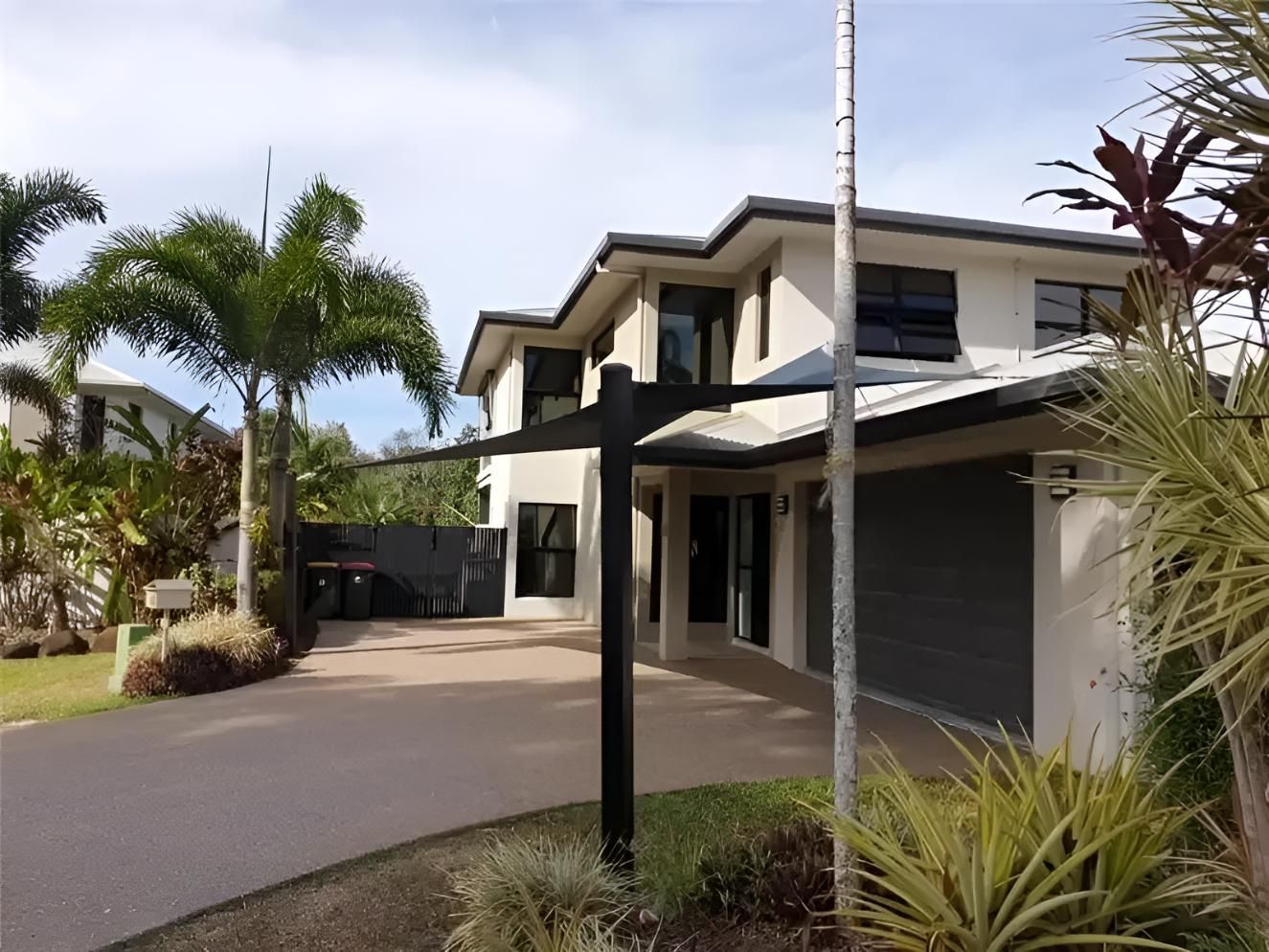 A Large House With a Mailbox in Front of It — Style Shades Installation In Ravenshoe, QLD