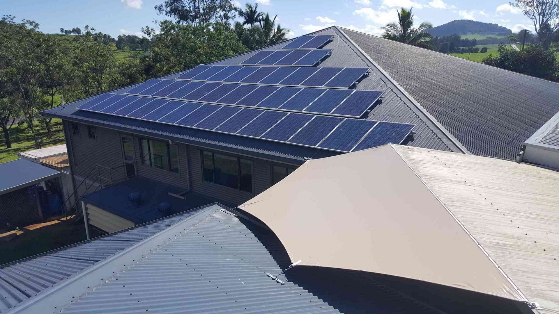 A House With A Lot Of Solar Panels On The Roof — Style Shades Installation In Edmonton, QLD