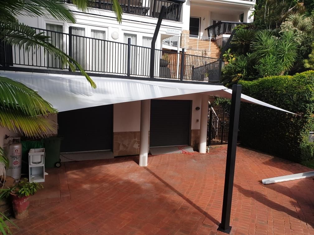 A House With A Balcony And A Carport Underneath It — Style Shades Installation In Edmonton, QLD
