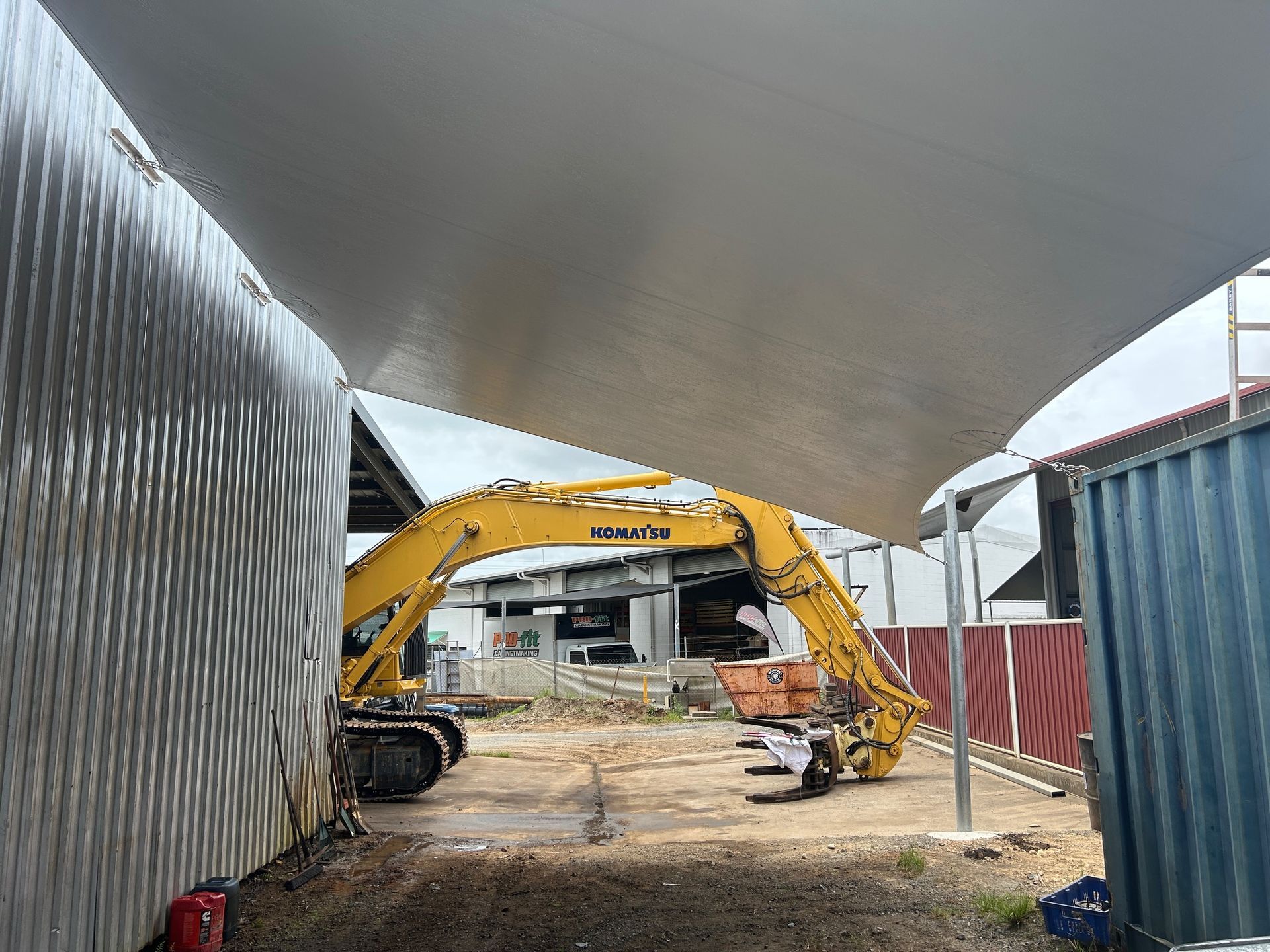 A Small Swimming Pool With A Black Umbrella Over It — Style Shades Installation In Edmonton, QLD