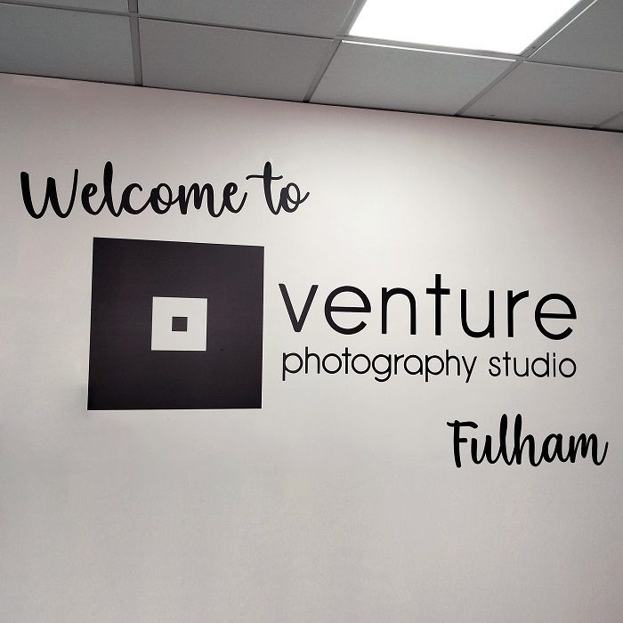 A sign on a wall that says welcome to venture photography studio fulham Custom Signs & Signage by Fulham Signs 