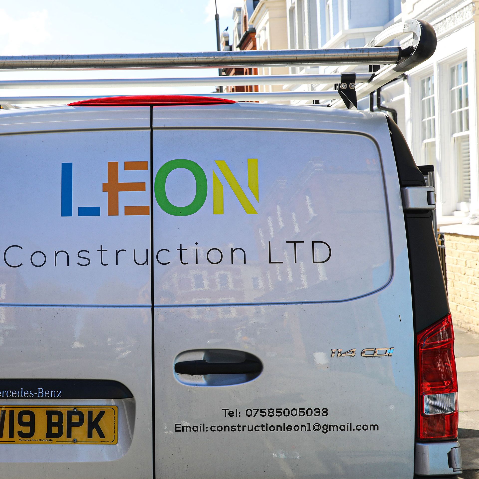 A leon construction ltd van is parked in front of a building Custom Signs & Signage by Fulham Signs 