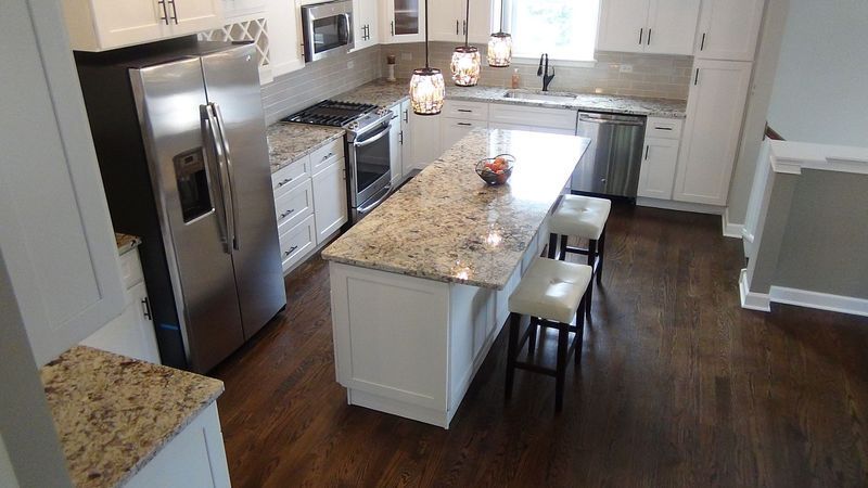 A kitchen with stainless steel appliances and granite counter tops