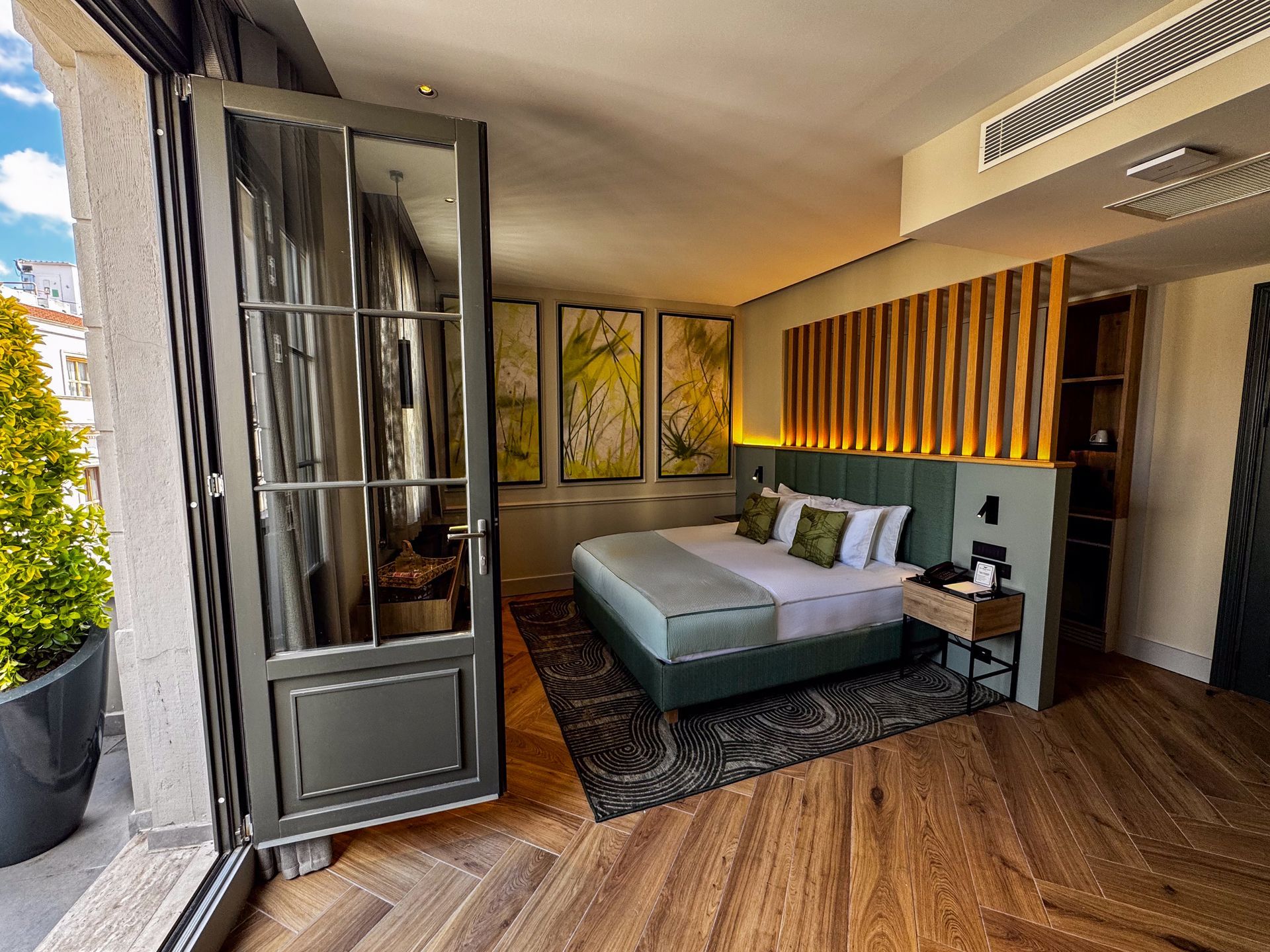 A train is going over a bridge over a body of water.