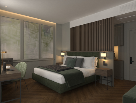 The Wings Hotels Pera | A hotel room with a large bed and a desk