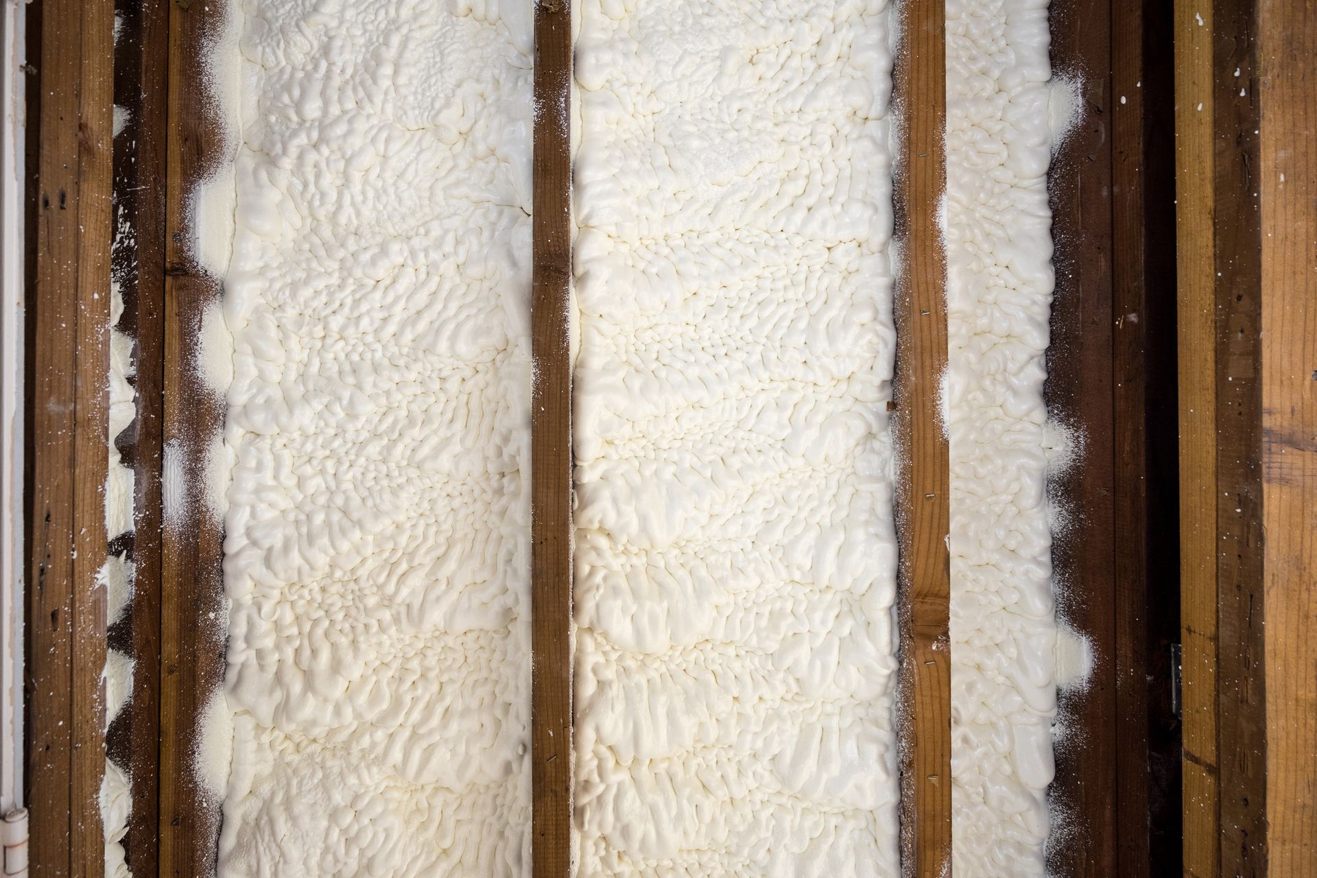 A close up of a wall with foam insulation on it.