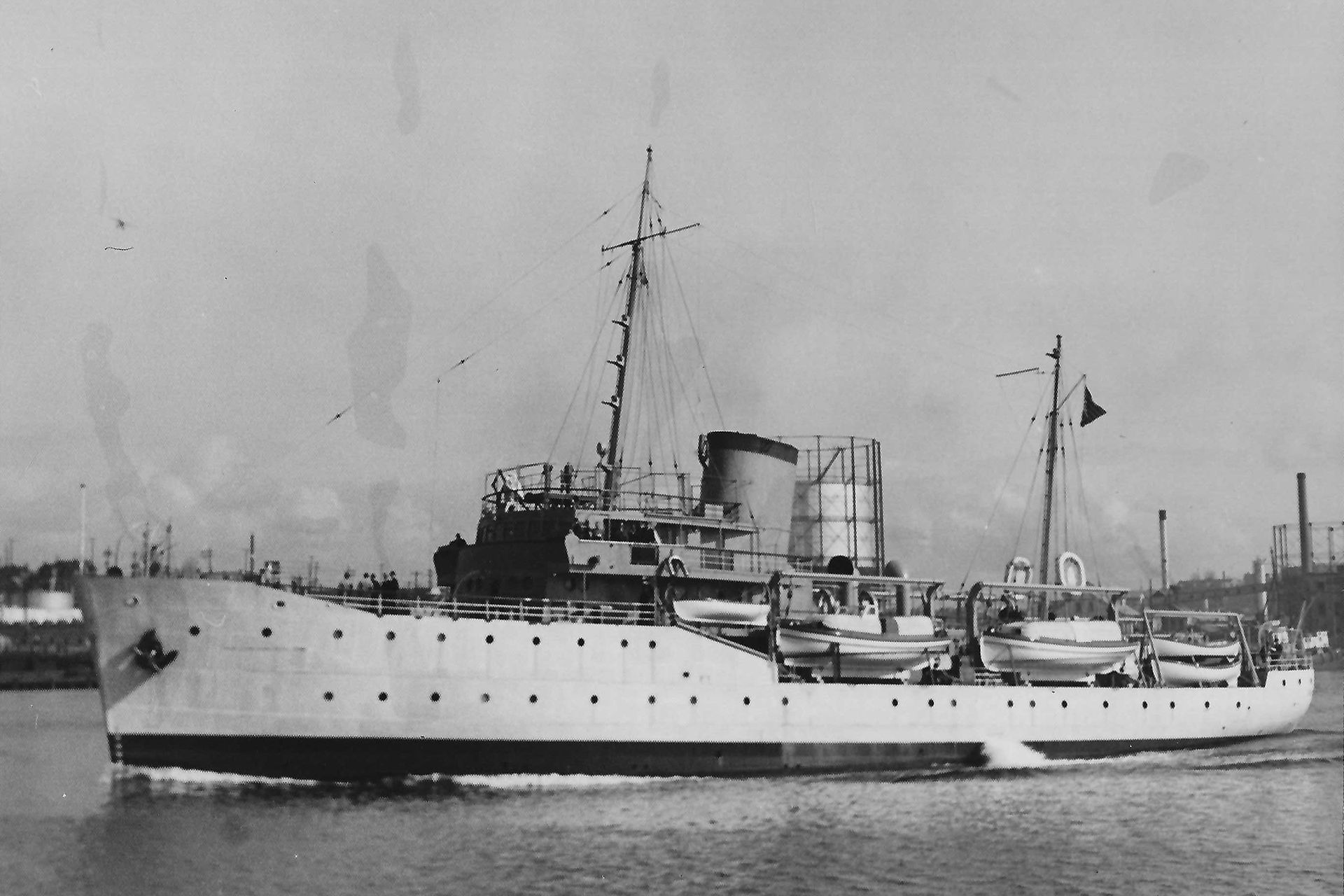 A black and white photo of a large ship in the water