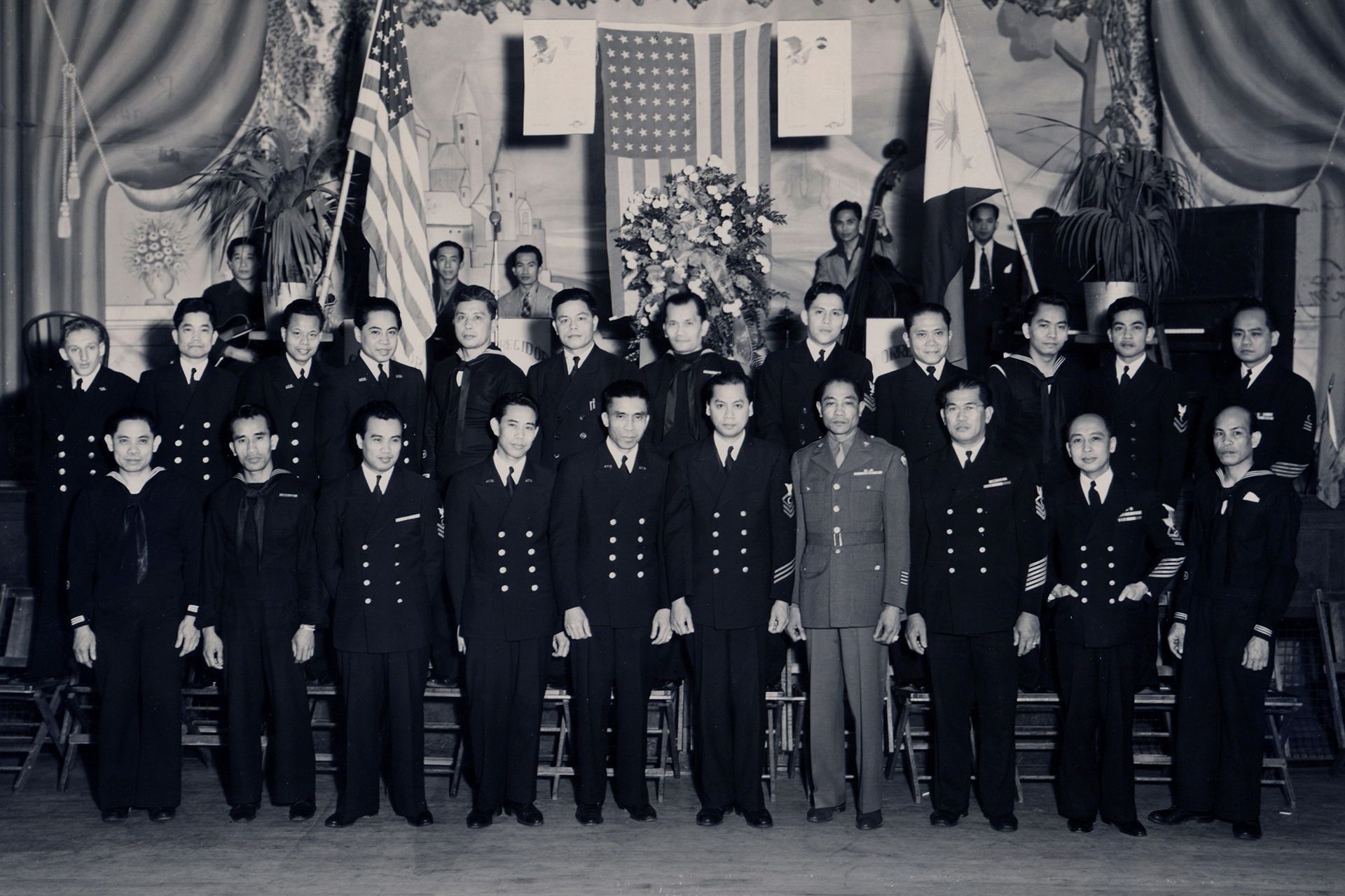 A black and white photo of a group of men in military uniforms