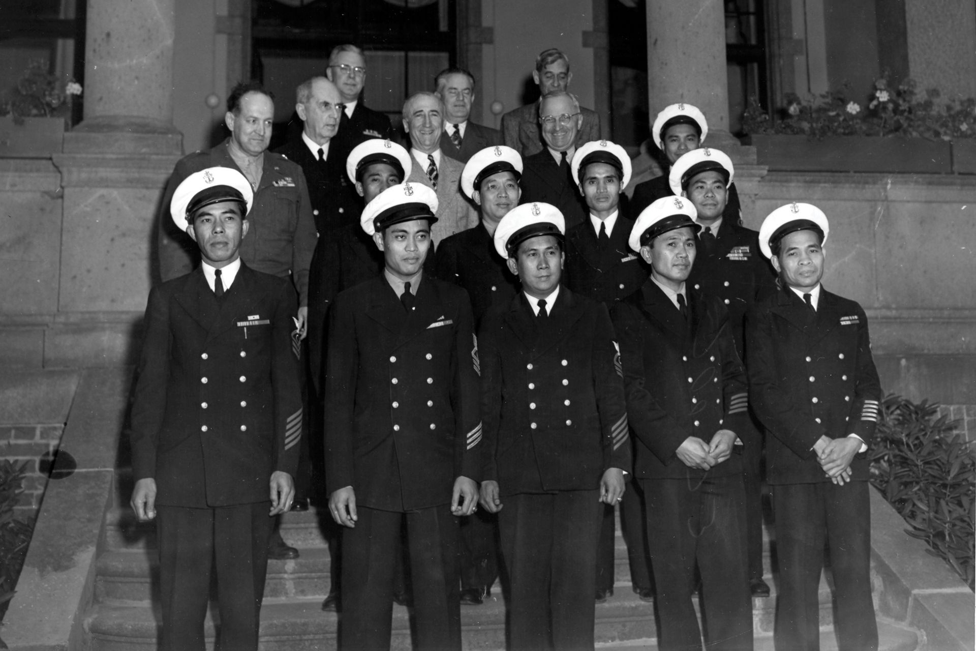 A black and white photo of a group of men in uniform