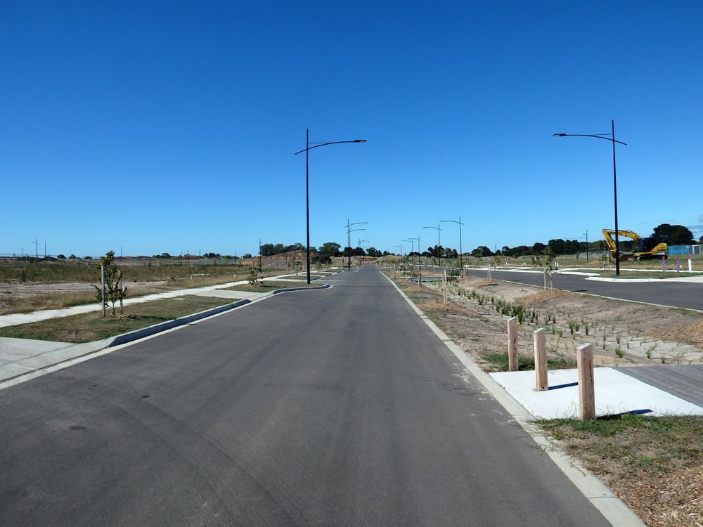 Paved Road With Streetlights — Peterson Property Valuations Brisbane in Caloundra West, QLD