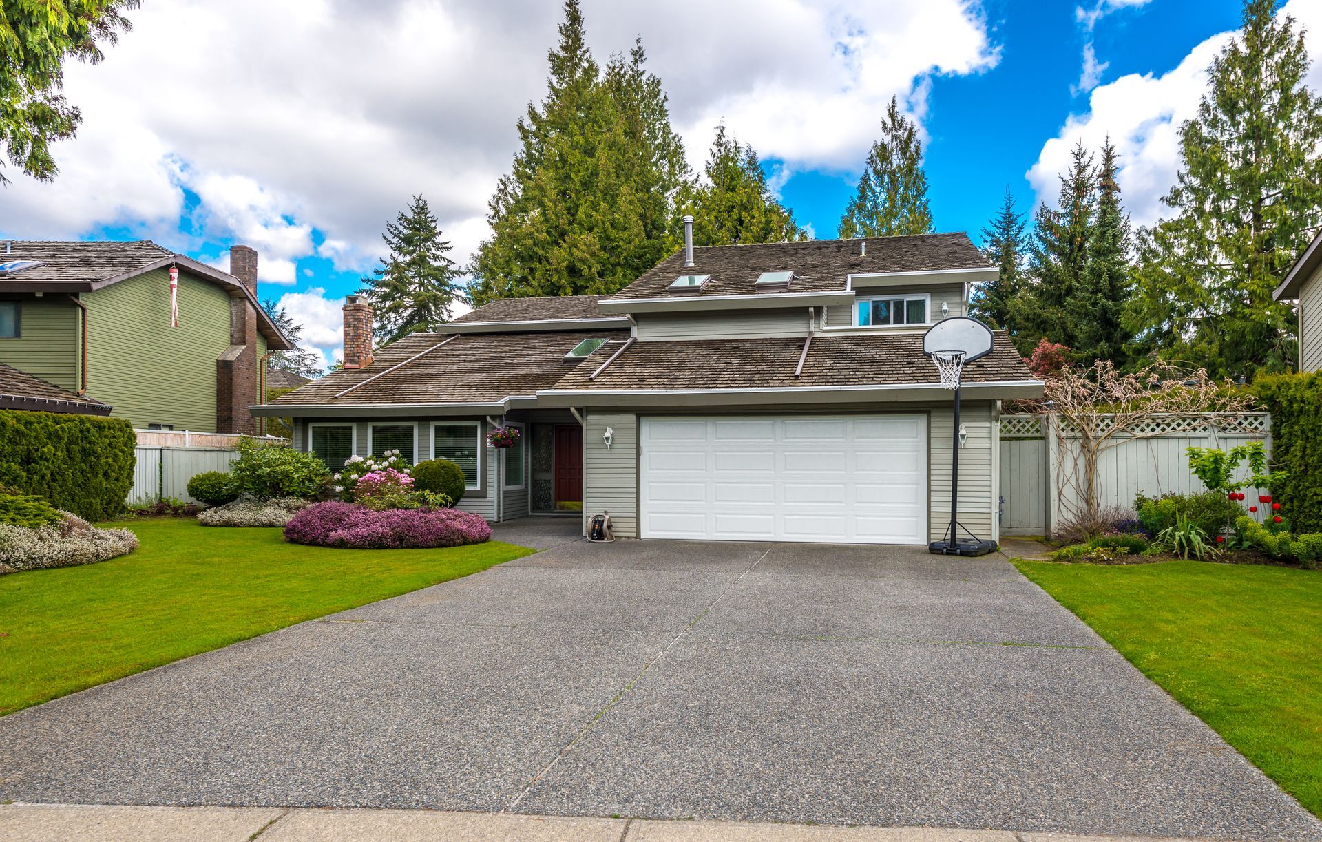 House With Gray Driveway — Peterson Property Valuations Brisbane in Southern M1 Gold Coast, QLD