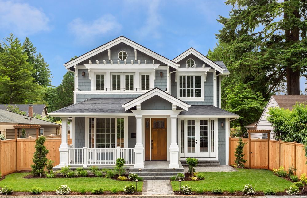 Two-Story Gray House With White Trim — Peterson Property Valuations Brisbane in Caboolture, QLD