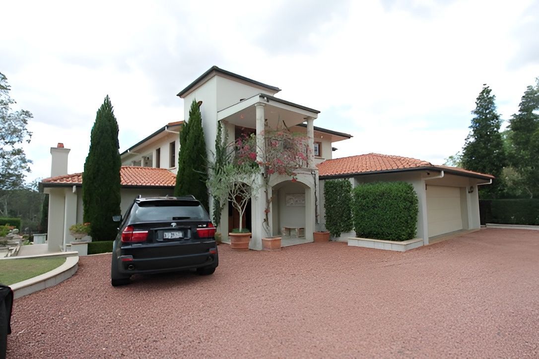 Large House With Red Tile Roof — Peterson Property Valuations Brisbane in Brisbane West, QLD