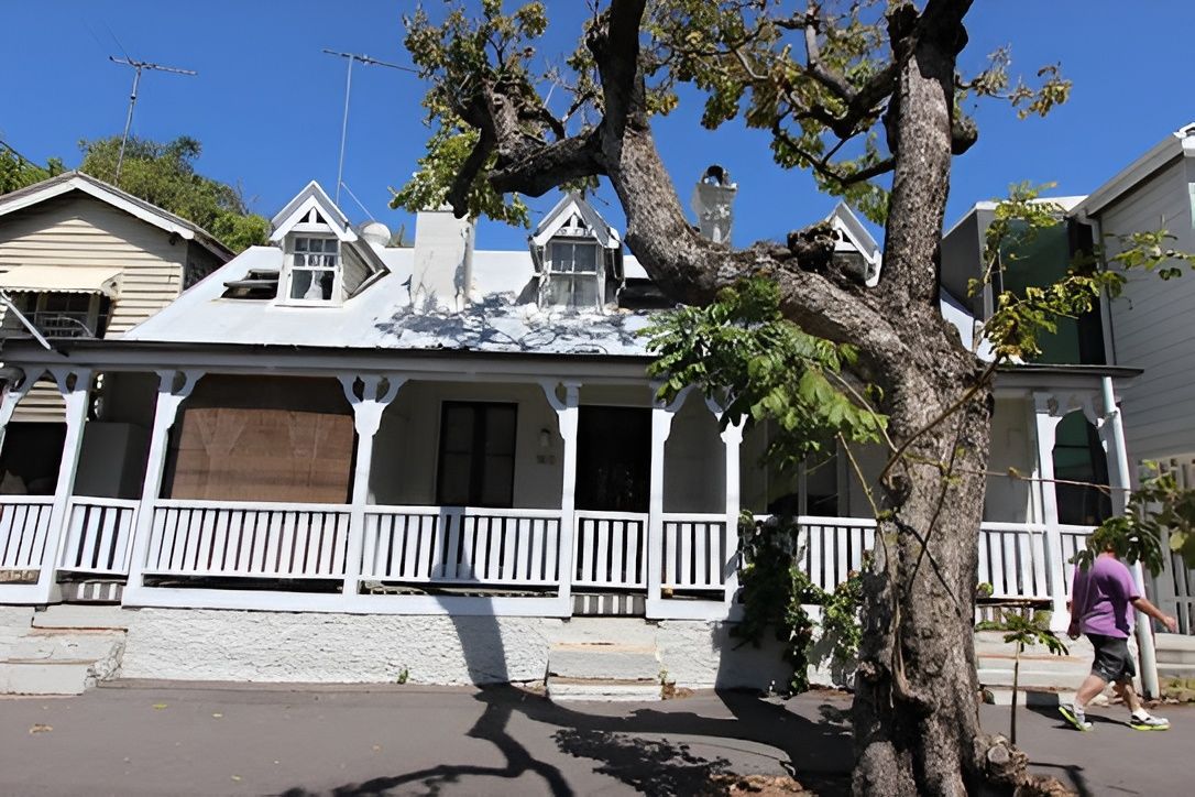 White House With a Porch and Three Dormers — Peterson Property Valuations Brisbane in Gold Coast, QLD