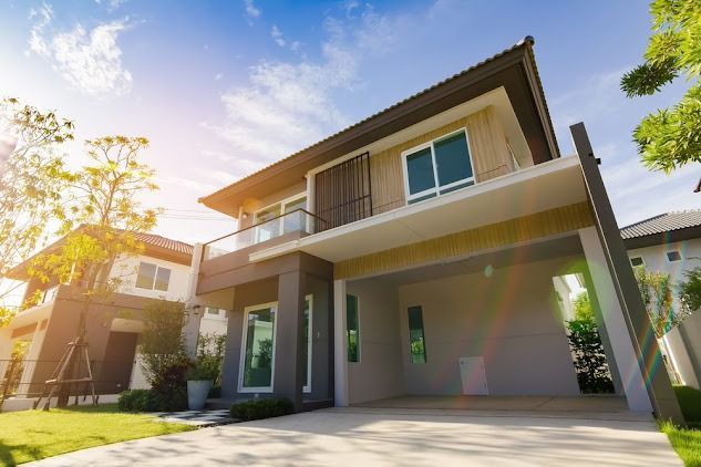 Modern Two-story House With Gray and Brown Facade — Peterson Property Valuations Brisbane in Caloundra West, QLD