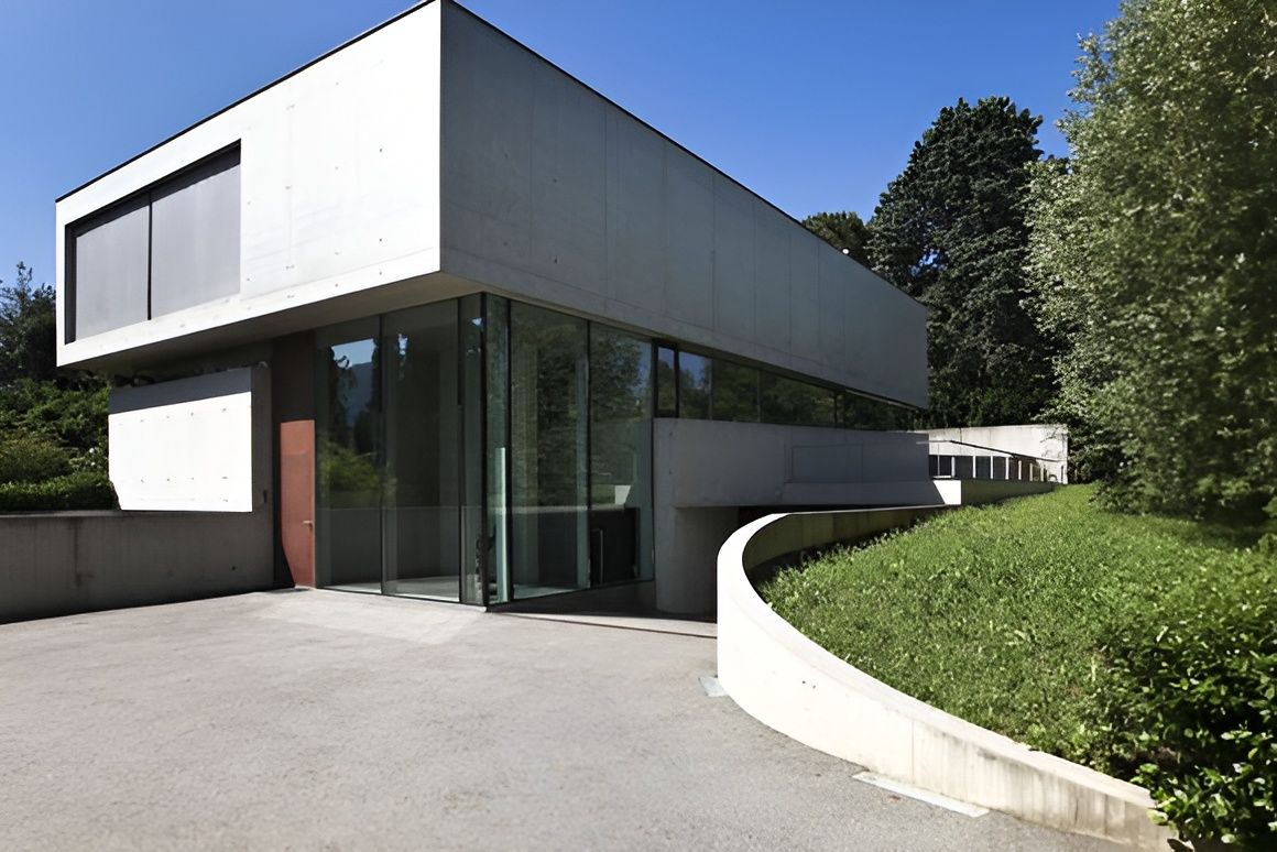 Modern Concrete and Glass Building With Driveway — Peterson Property Valuations Brisbane in Caboolture, QLD