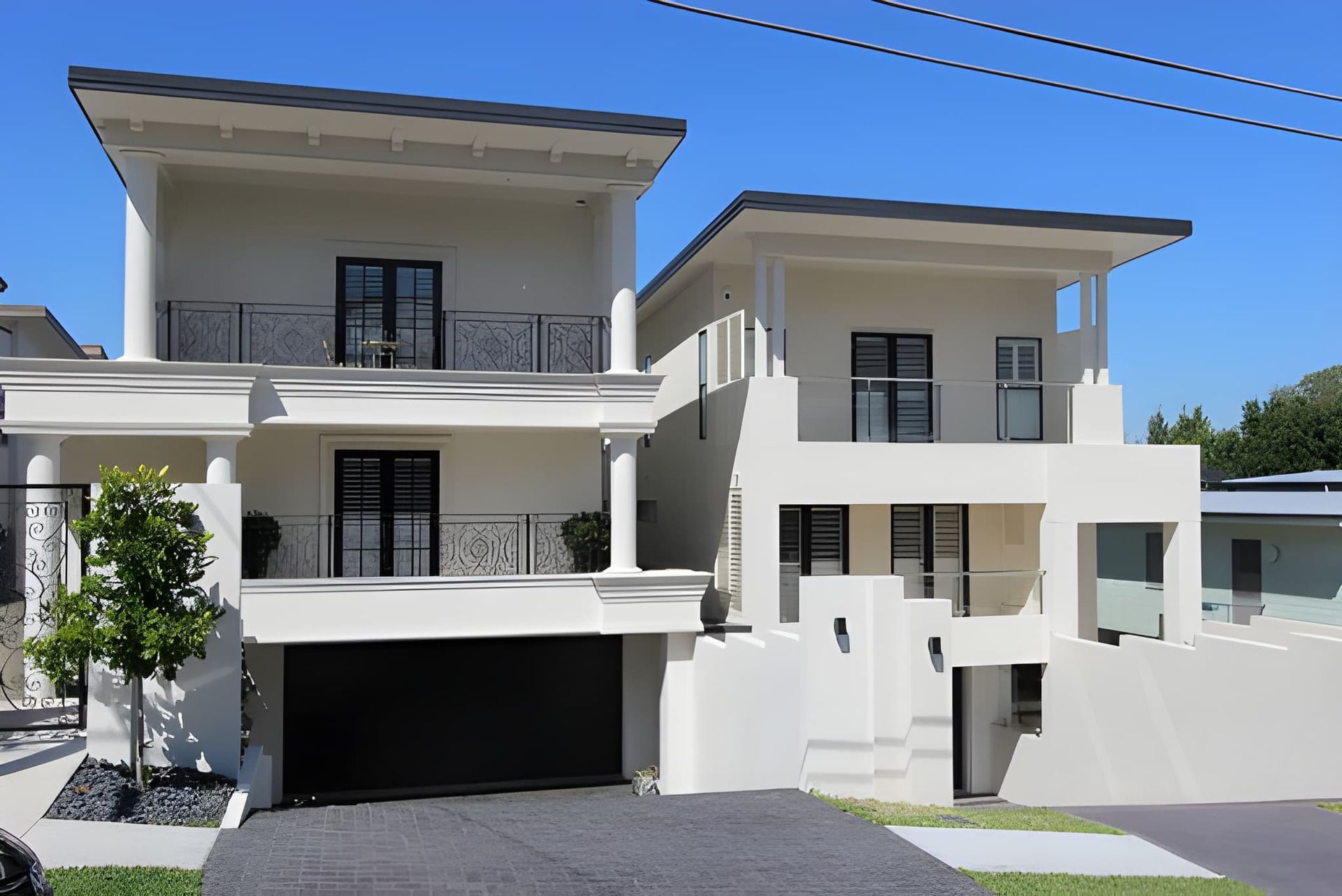Two-Story White Houses With Balconies — Peterson Property Valuations Brisbane in Logan, QLD
