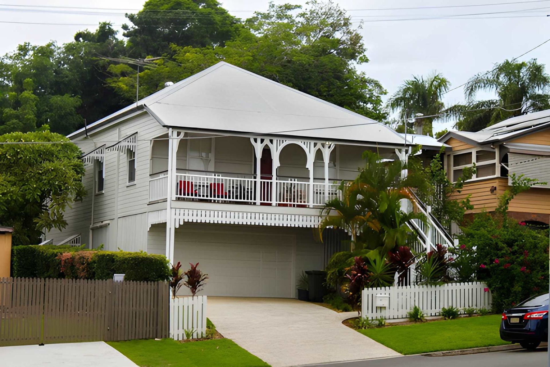 Two-Story White House With a Covered Balcony — Peterson Property Valuations Brisbane in Logan, QLD