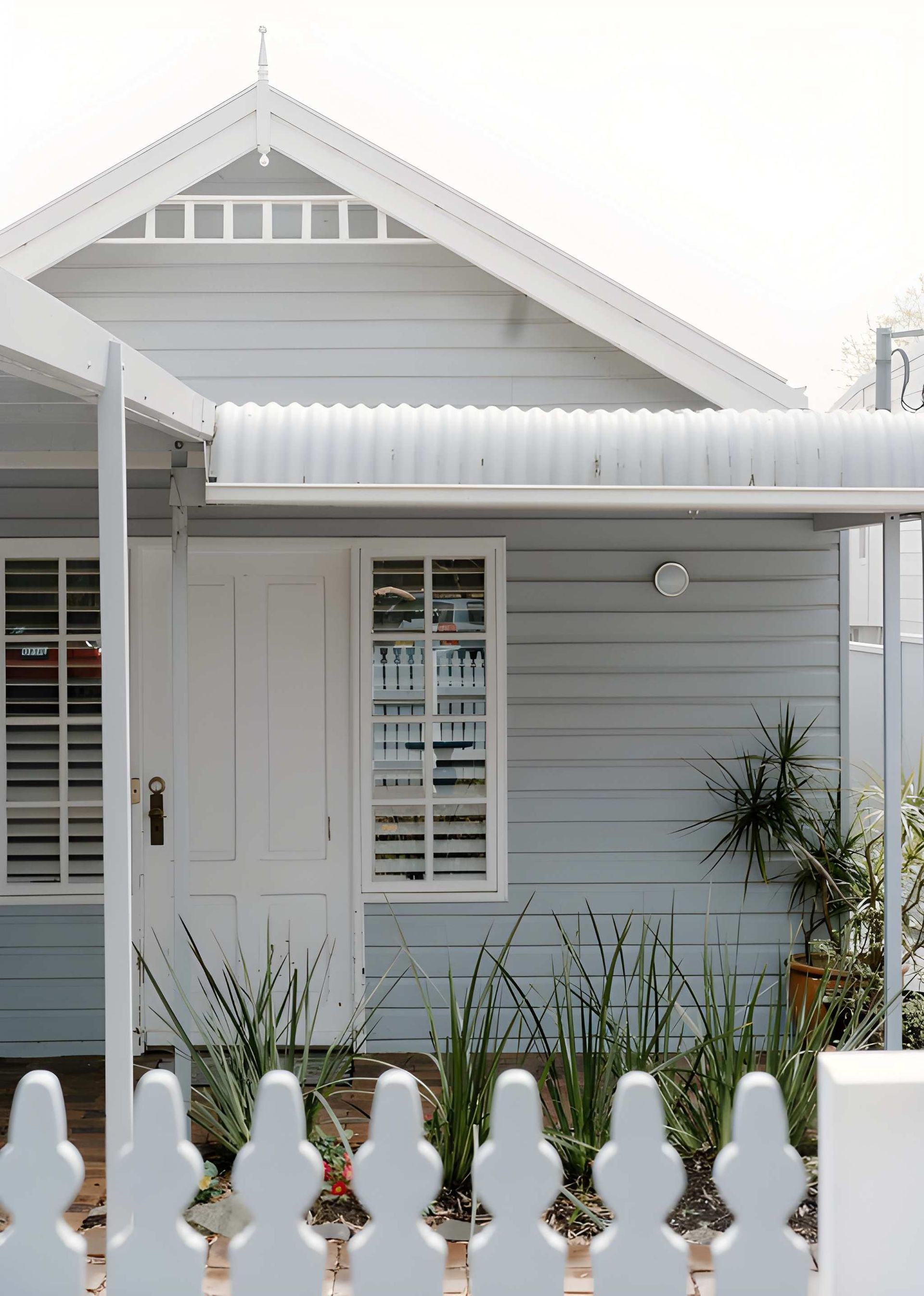 Light Blue House With White Trim — Peterson Property Valuations Brisbane in Caloundra West, QLD