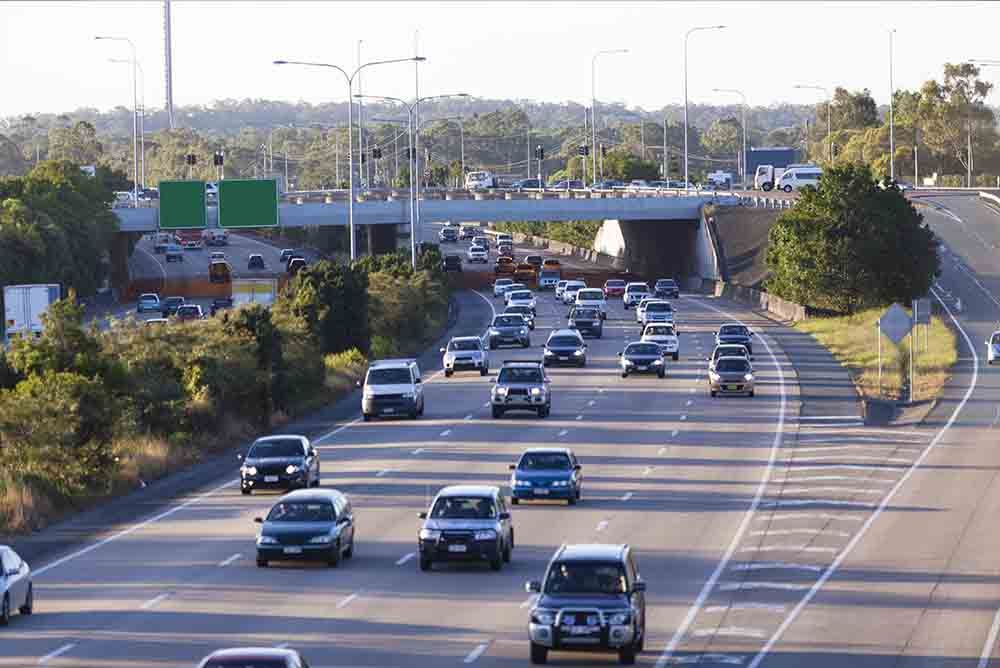 Cars Driving on a Multi-lane Highway — Peterson Property Valuations Brisbane in Caloundra West, QLD