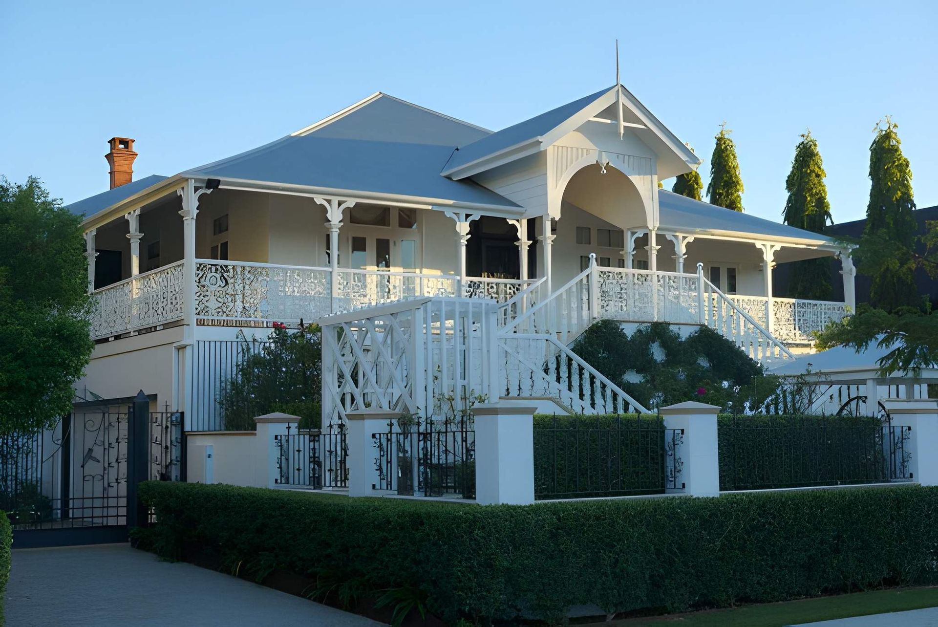 White Two-story House With Wrap-around Porch — Peterson Property Valuations Brisbane in Ipswich, QLD