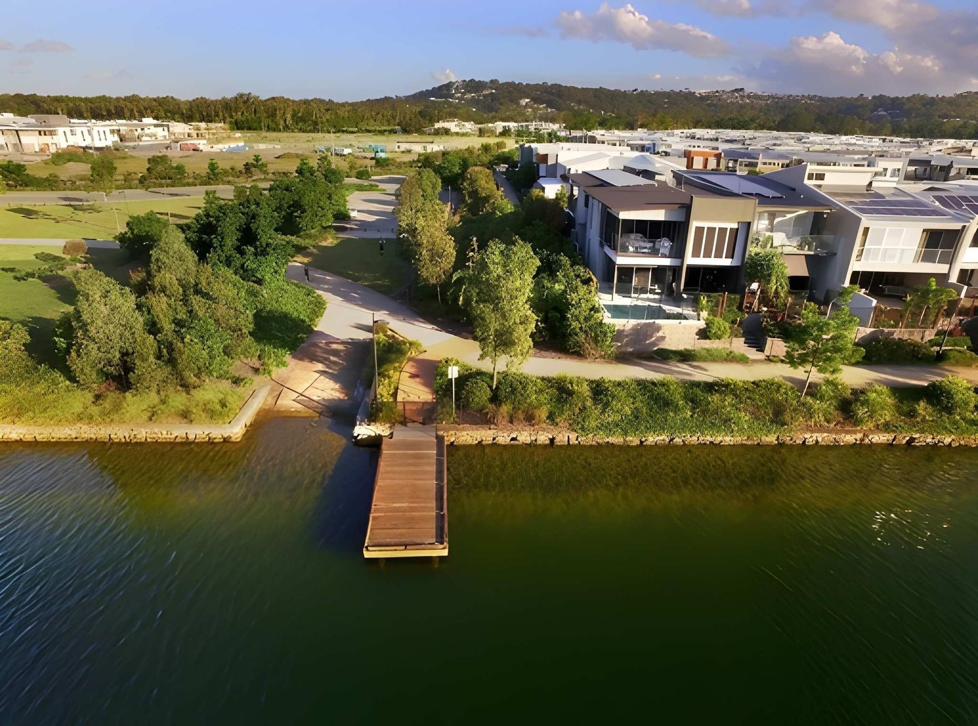 Aerial View of a Dock on a Lake — Peterson Property Valuations Brisbane in Caloundra West, QLD