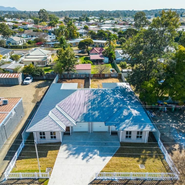 An Aerial View of A House with A Blue Roof — Jonobilt in Bolwarra, NSW