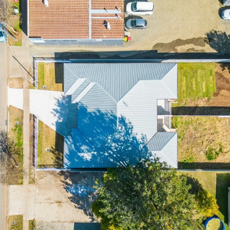 An Aerial View of A House with A Gray Roof — Jonobilt in Bolwarra, NSW