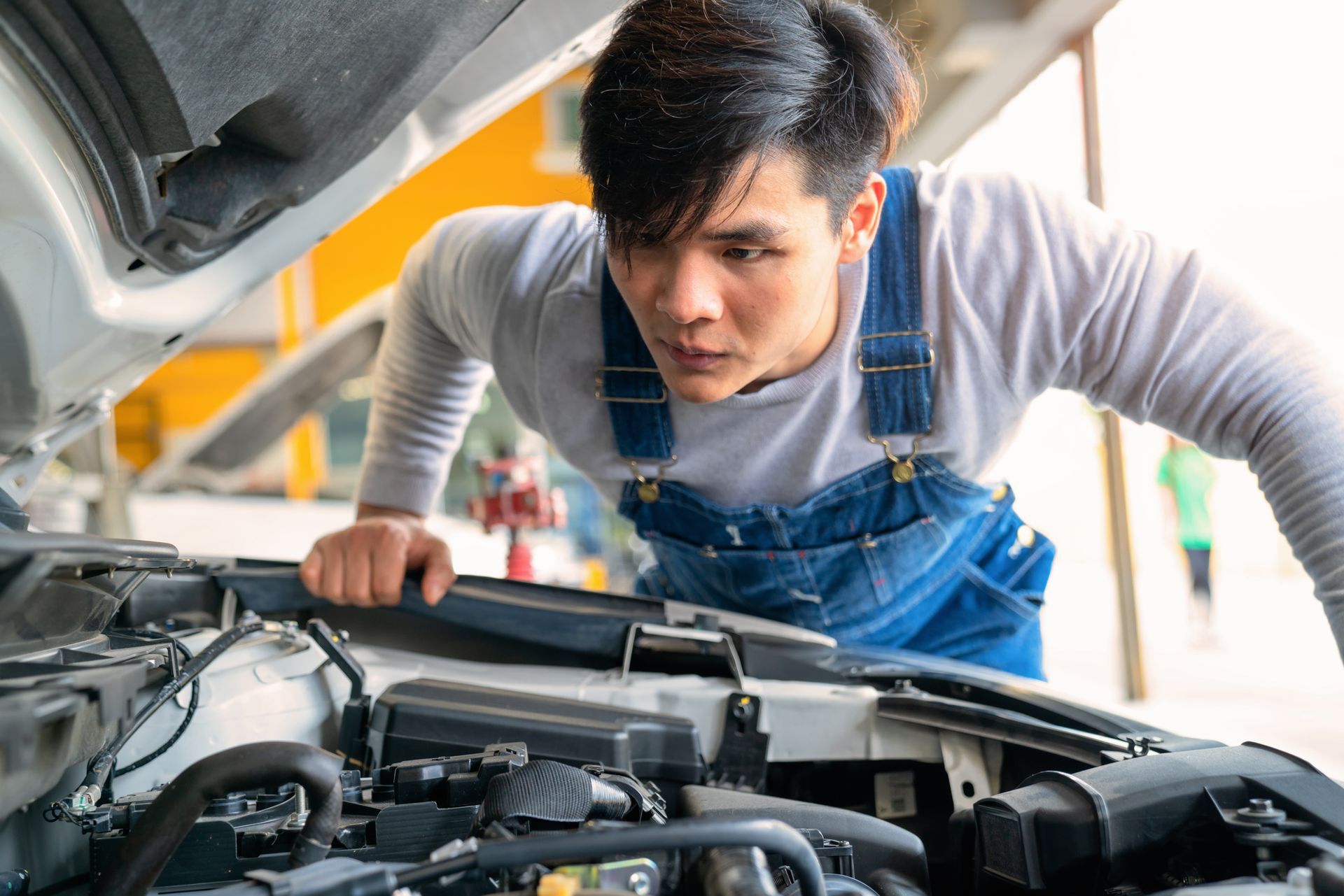 mechanic doing a car repair for level 1 accredited service provider