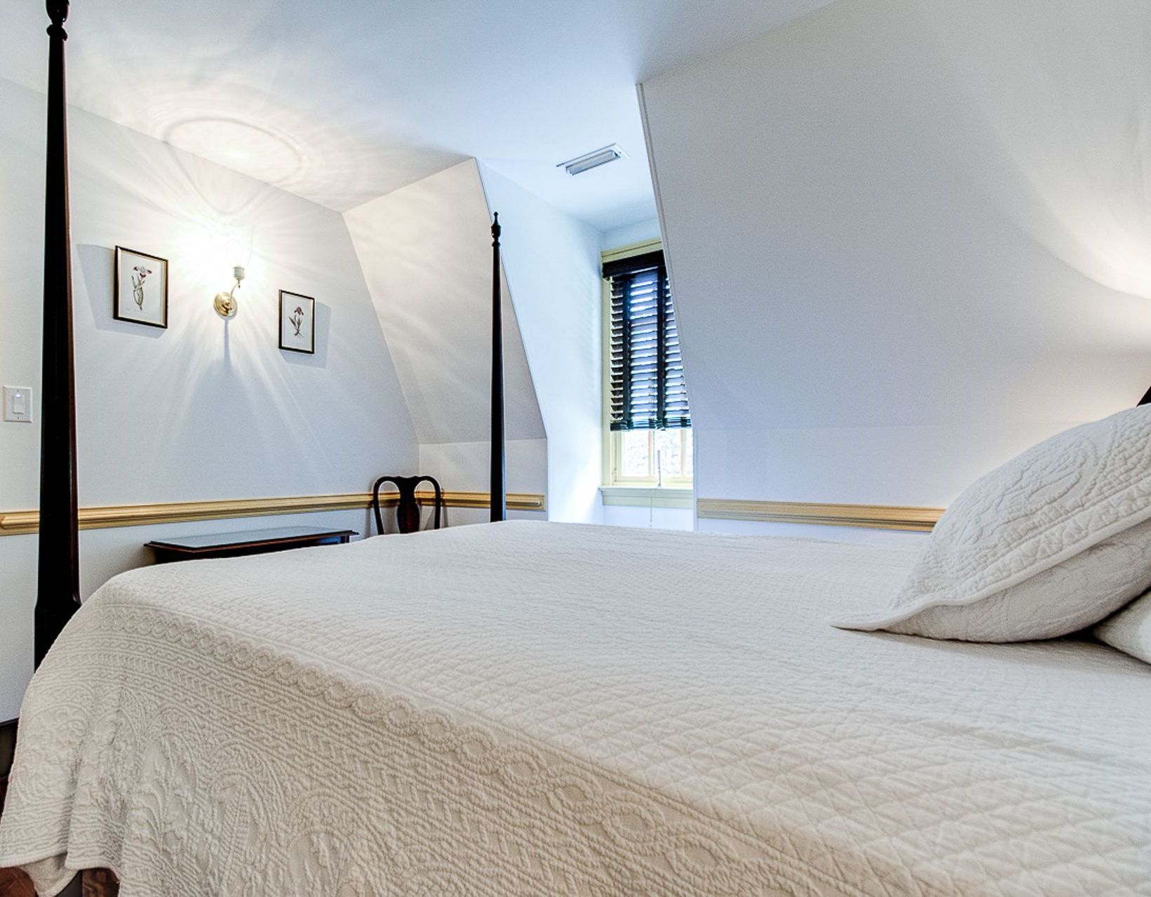 This is a photo of the bed in the Peach room of the BNB.