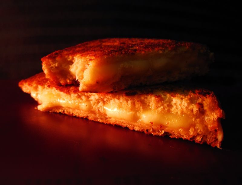 Picture of a grilled cheese sandwich on multigrain bread.