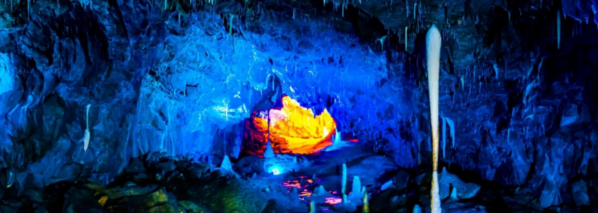 Picture of stalactites and stalagmites at Stump Cross.
