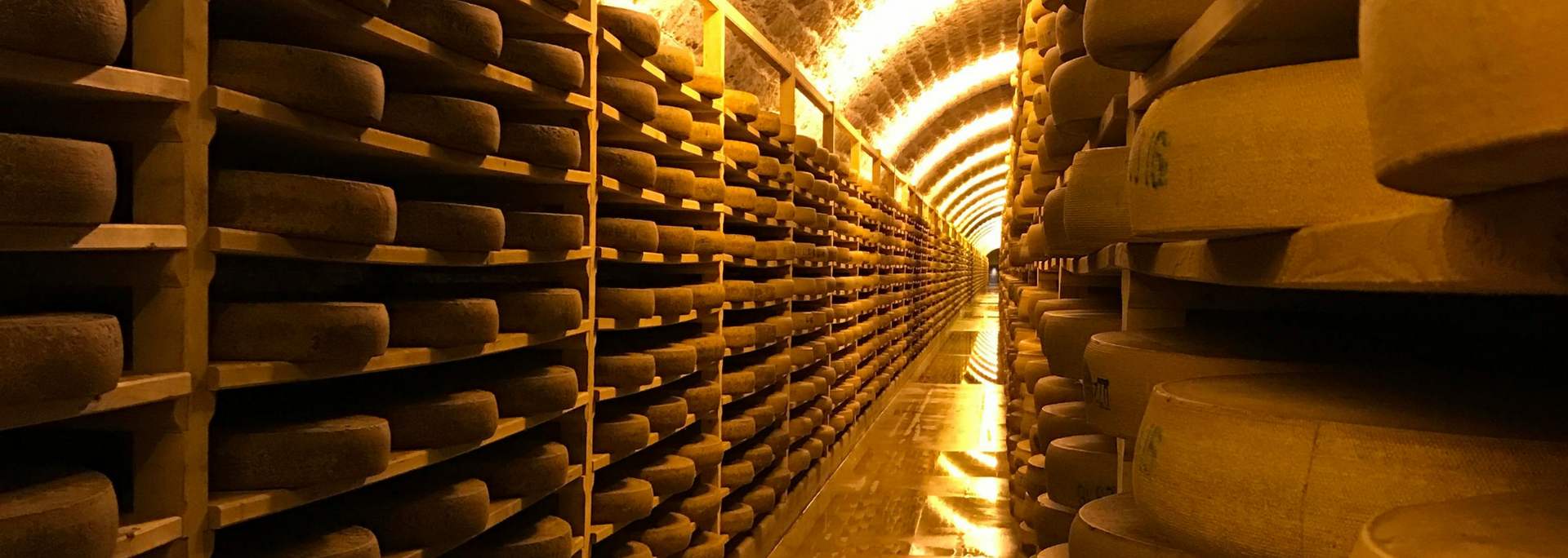 Picture of cheese ageing in caves.