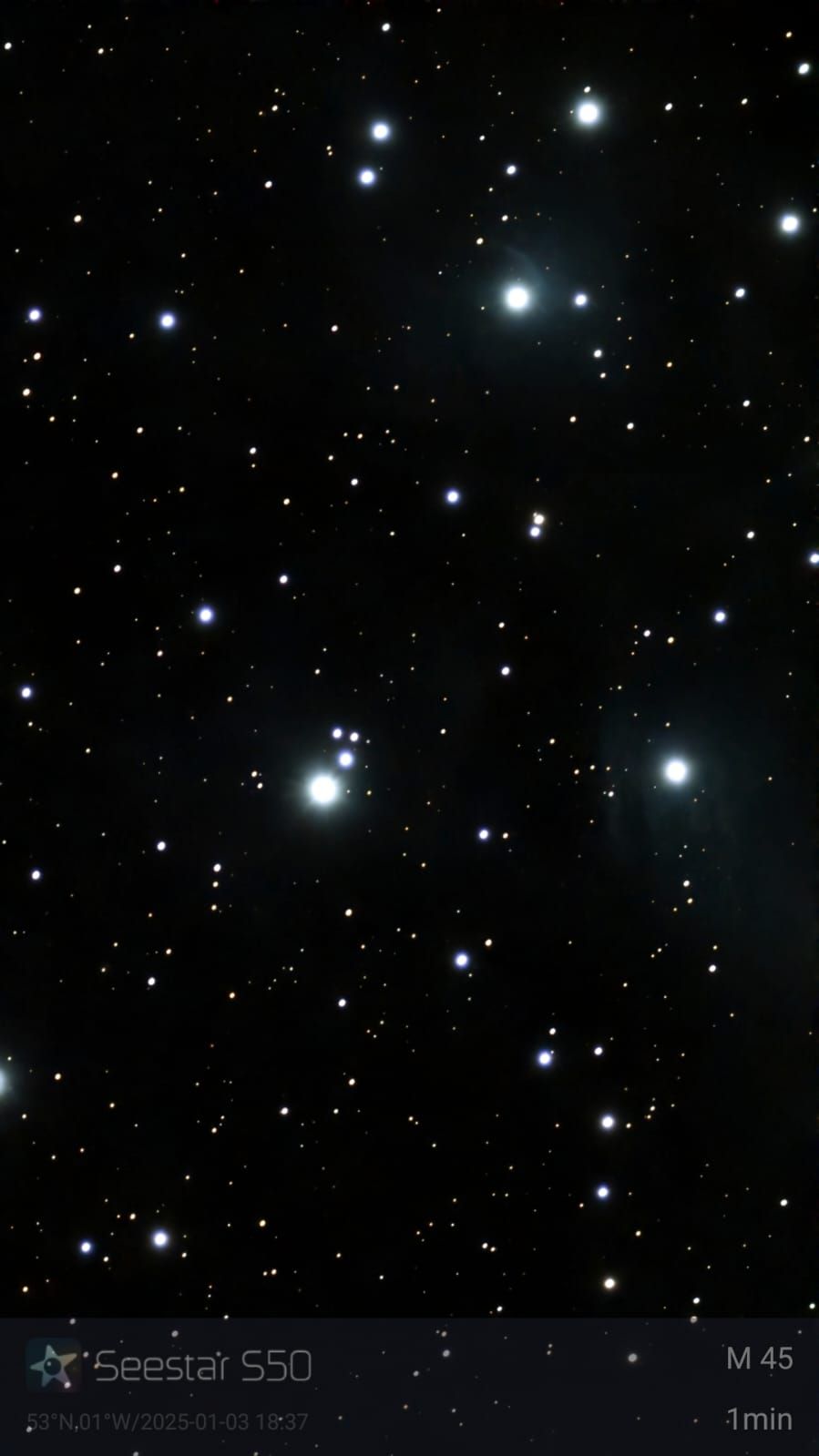 Stars of the open cluster M45, also known as the Pleiades. Bright, blue-white stars on a black background.