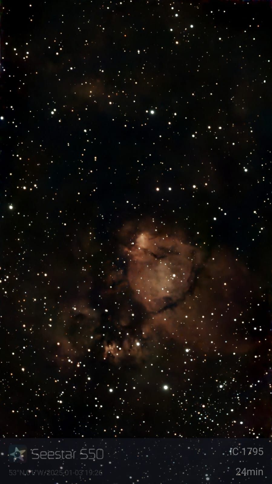 Dark nebula of IC 1396, a diffuse nebula in Cepheus. Brown and dark clouds surrounded by stars.