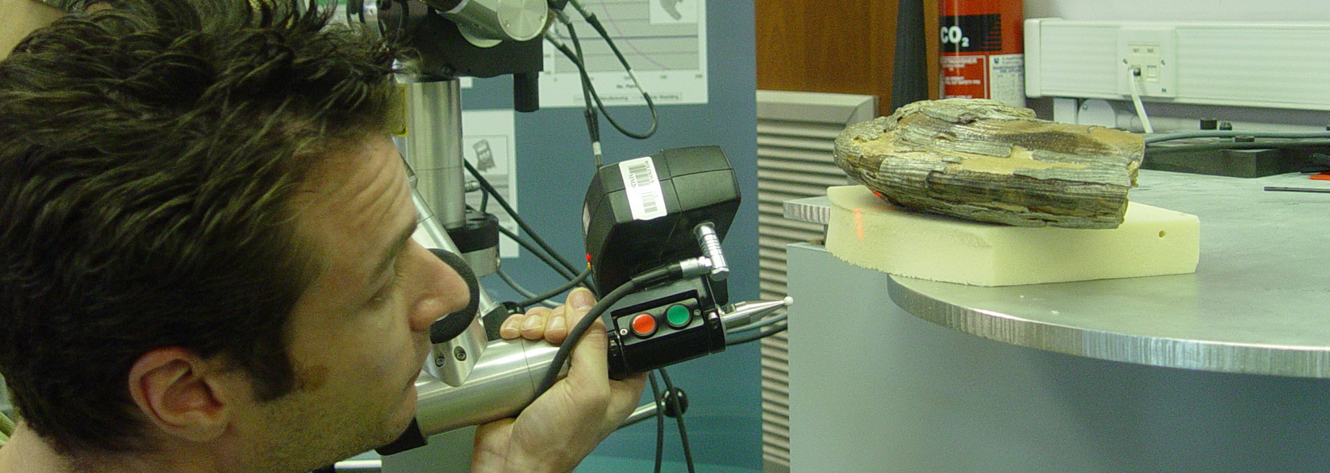 Picture of fossil being laser scanned. Picture of fossil being laser scanned.