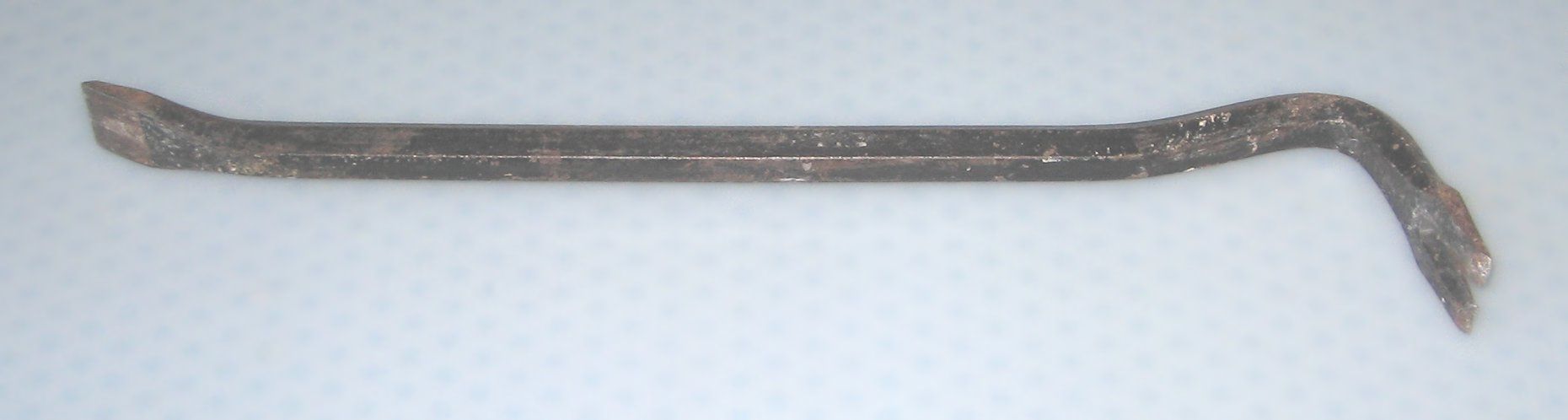 Picture of an old crowbar.